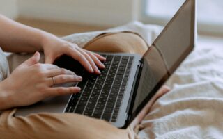 Stock image of person on laptop computer